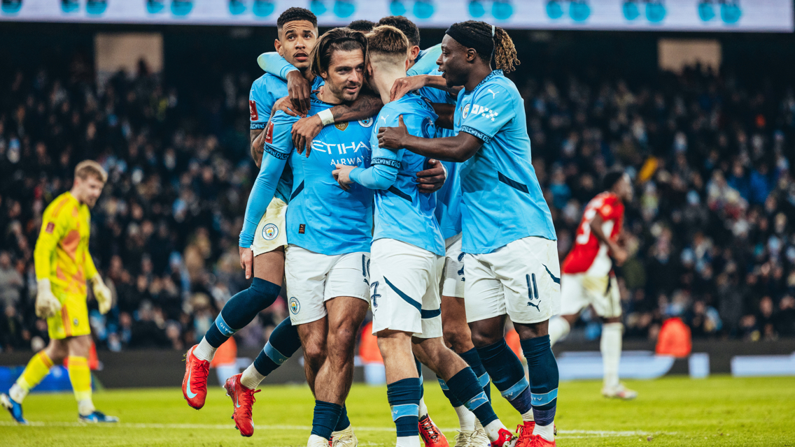 GROUP HUG: Grealish feels the love!