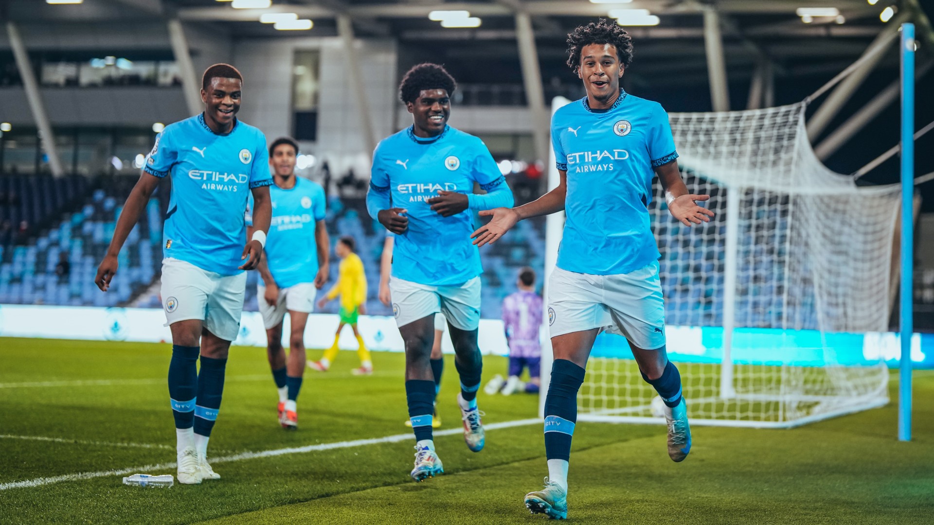  : Emilio Lawrence and his team-mates celebrate taking the lead. 