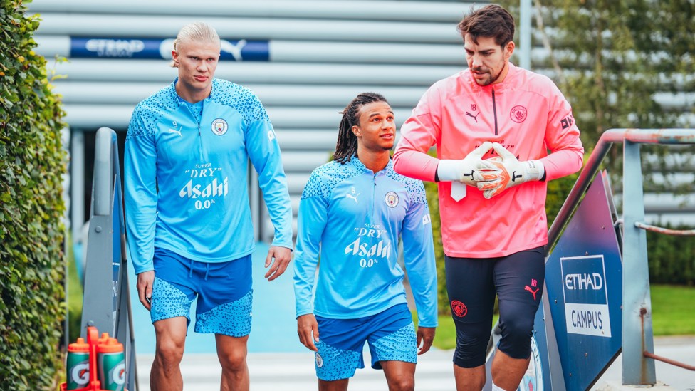 HEAR IT FOR THE BOYS  : Erling Haaland, Stefan Ortega and Nathan Ake make their way onto the pitch.