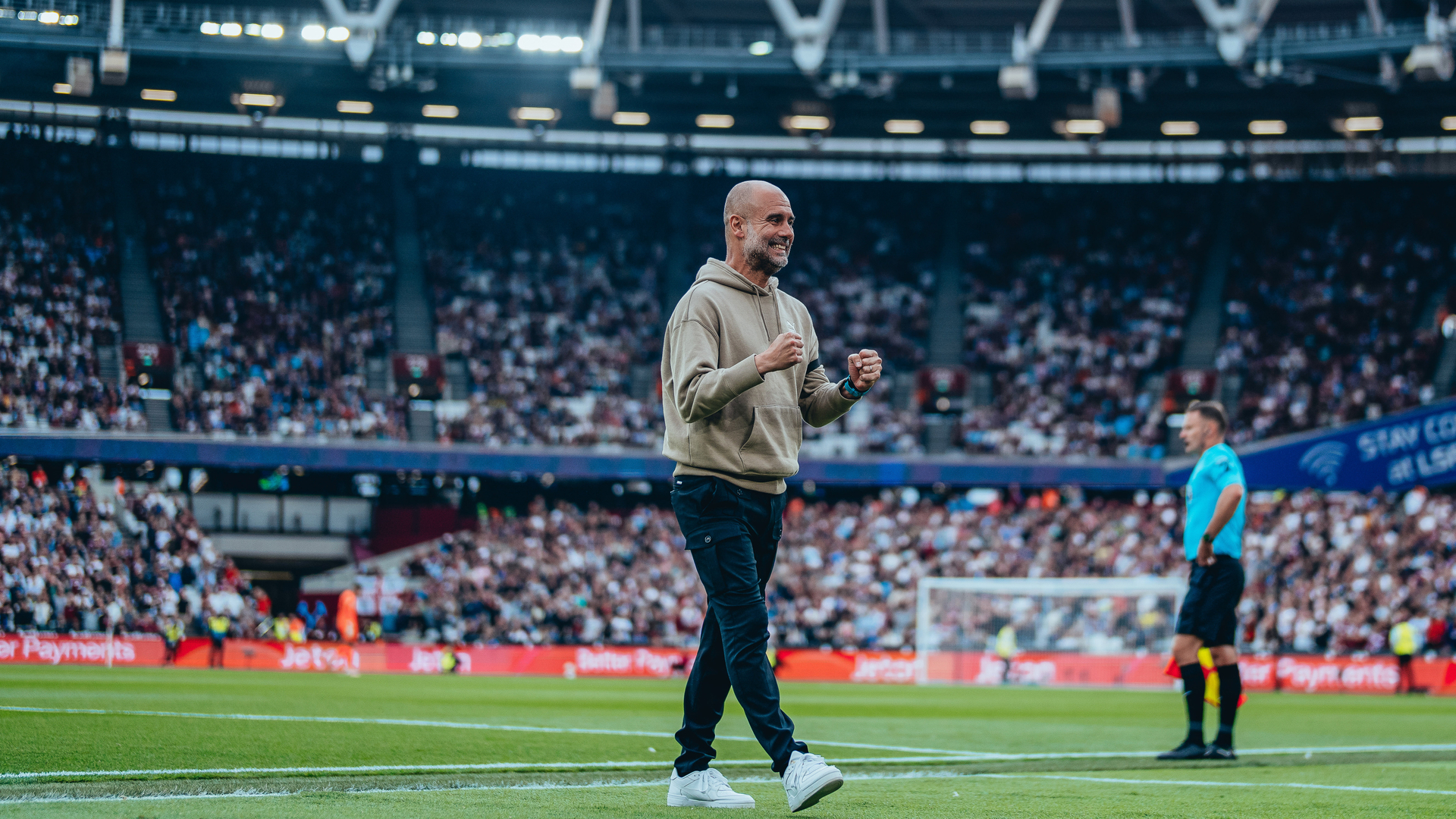 ALL SMILES: Pep celebrates after Haaland's second strike.