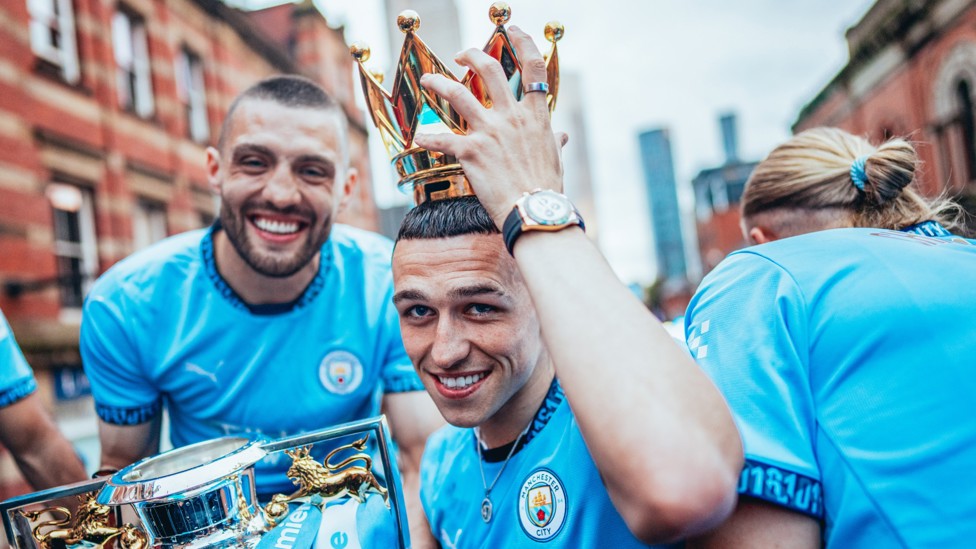 CROWN PRINCE : Phil Foden enjoying life as a champion on our ‘4-In-A-Row’ parade around Manchester.