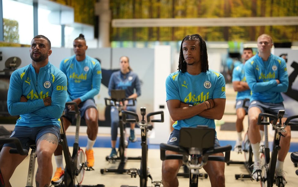 GYM WORK: The lads warm down while watching videos