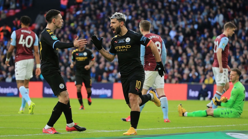 ROAR : Aguero celebrates his opener with the lively Foden.