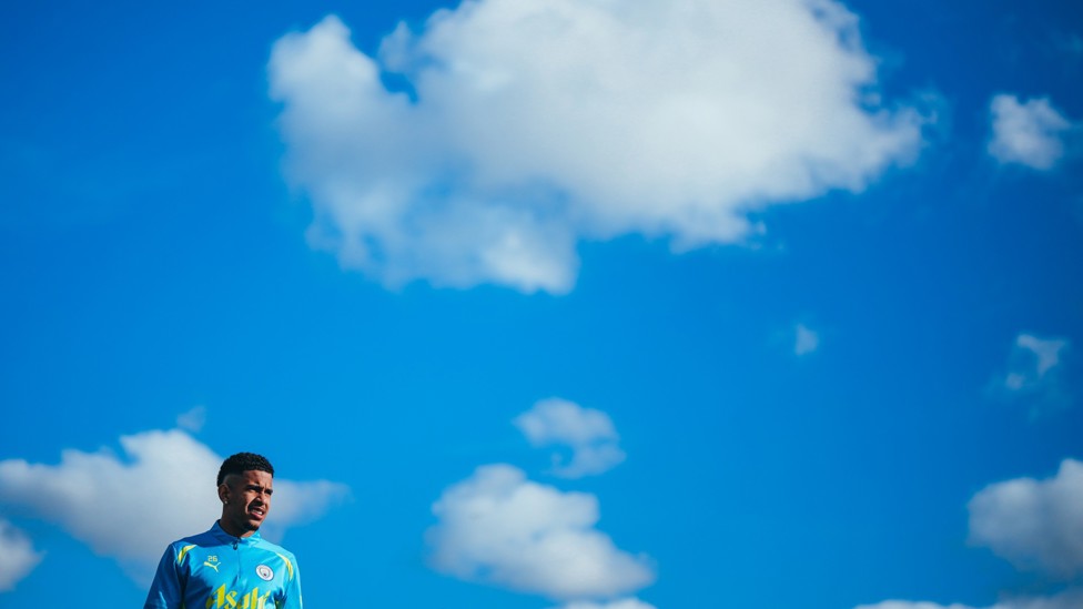 MR BLUE SKY  : Savinho heads back onto the field.