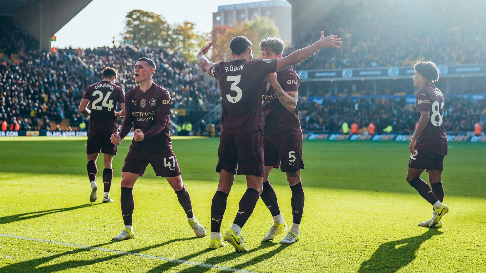 JOY BOYS: City celebrate after John Stones' dramatic late winner.