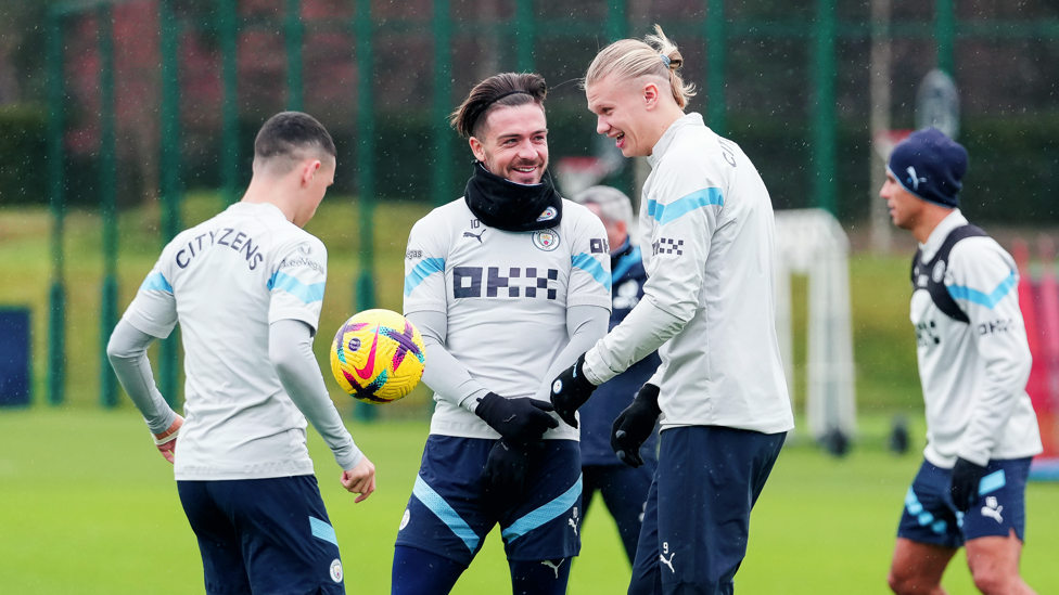 THE LADS : Jack Grealish and Haaland share a joke while Foden continues to show his skills