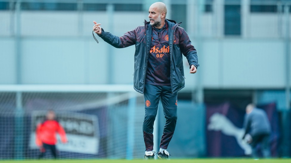 TAKING CHARGE : Pep Guardiola keeps an eye on training