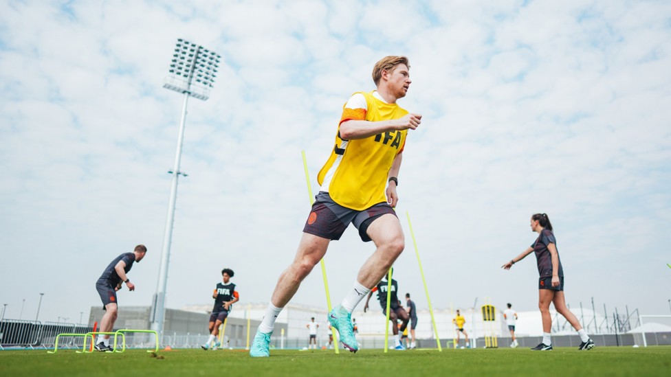 STRETCHING THE LEGS : Kevin De Bruyne starts the session with a light run.