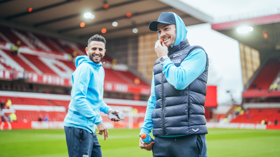 ALL SMILES : Mahrez and Grealish in good spirits whilst inspecting the pitch.