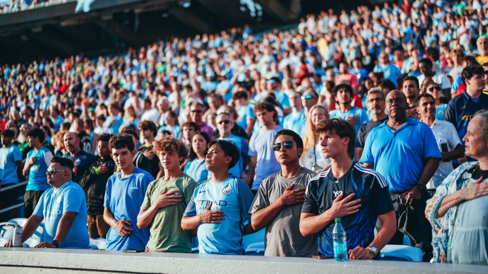 STANDING ROOM : Fans take to their feet in the stands ahead of the match