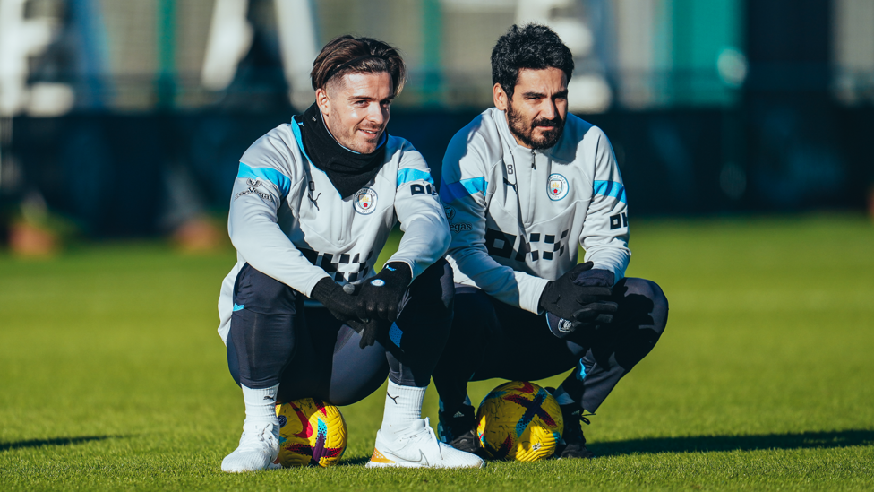 SITTING PRETTY: Jack Grealish and Ilkay Gundogan take a breather during Friday's session.