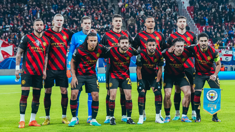 SQUAD GOALS : The starters strike a pose ahead of kick-off.