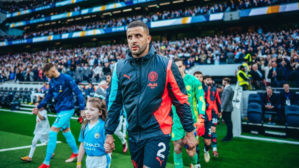 GO TIME  : Walker leads out City's players.