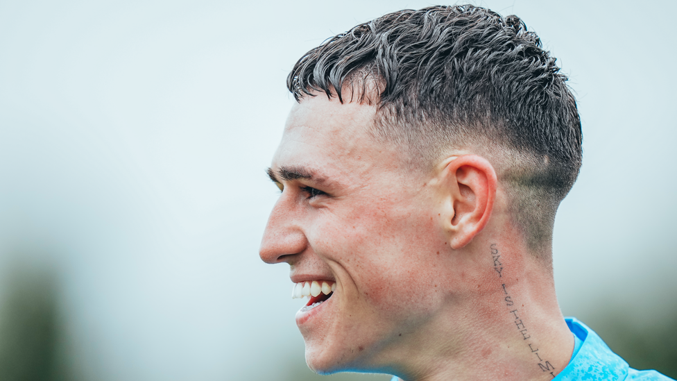 ONE OF OUR OWN : Phil Foden in great spirits in the Manchester rain.