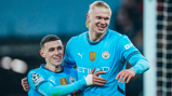 ALL SMILES: Foden and Haaland celebrate.