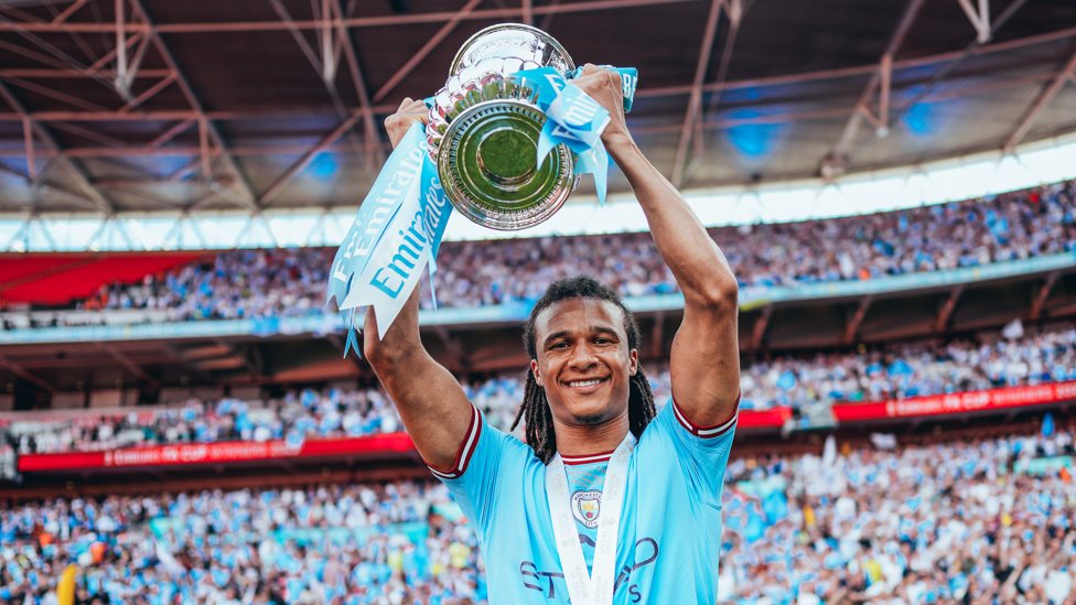 WEMBLEY WONDER: Ake holds the FA Cup after our 2023 final win against Manchester United