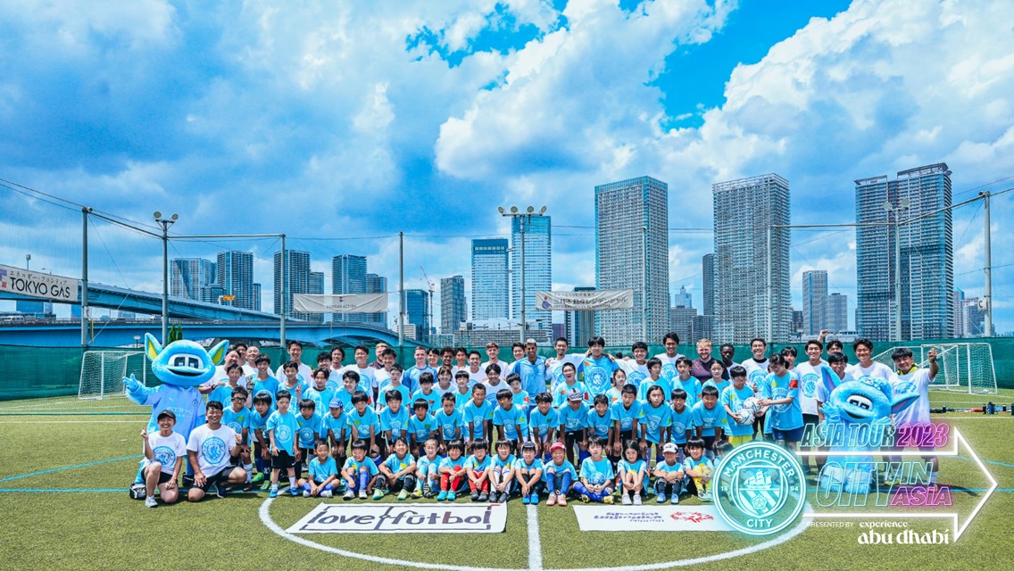 Players visit community football festival in Tokyo