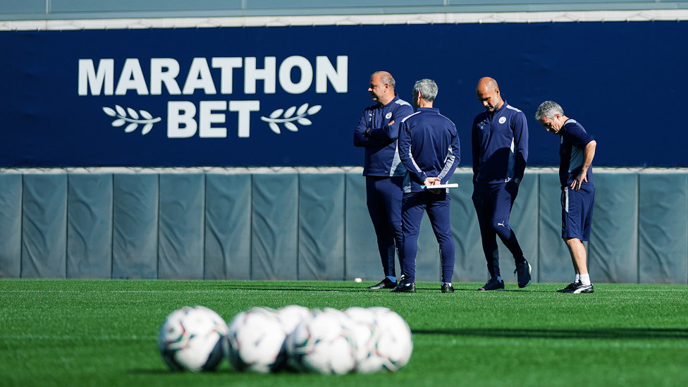 WATCHING BRIEF: Pep Guardiola and members of the City coaching team take stock