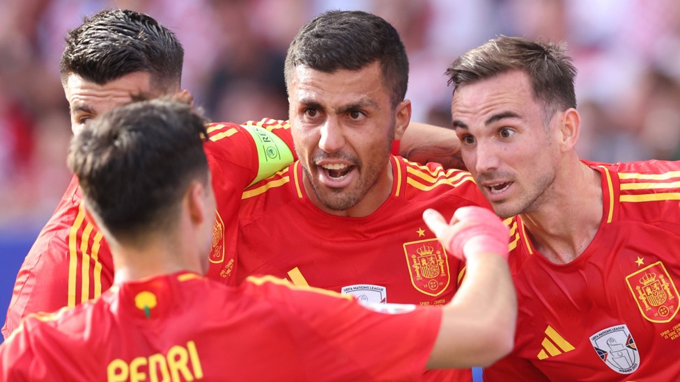 MAN IN THE MIDDLE : At the centre of celebrations in the 3-0 victory over Croatia