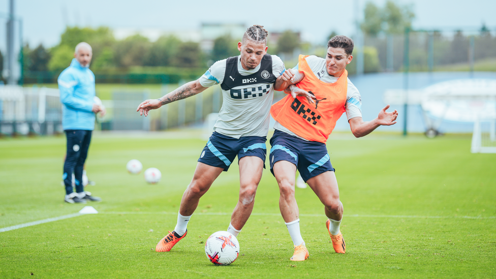 BATTLING IT OUT : Kalvin Phillips holds off Julian Alvarez.