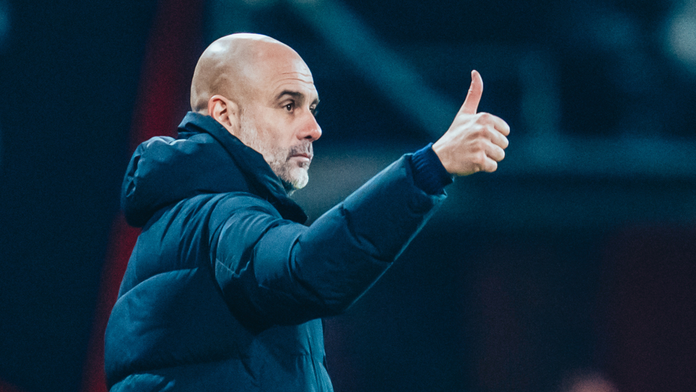 HAPPY WITH THAT : Pep Guardiola gives the seal of approval to his players.