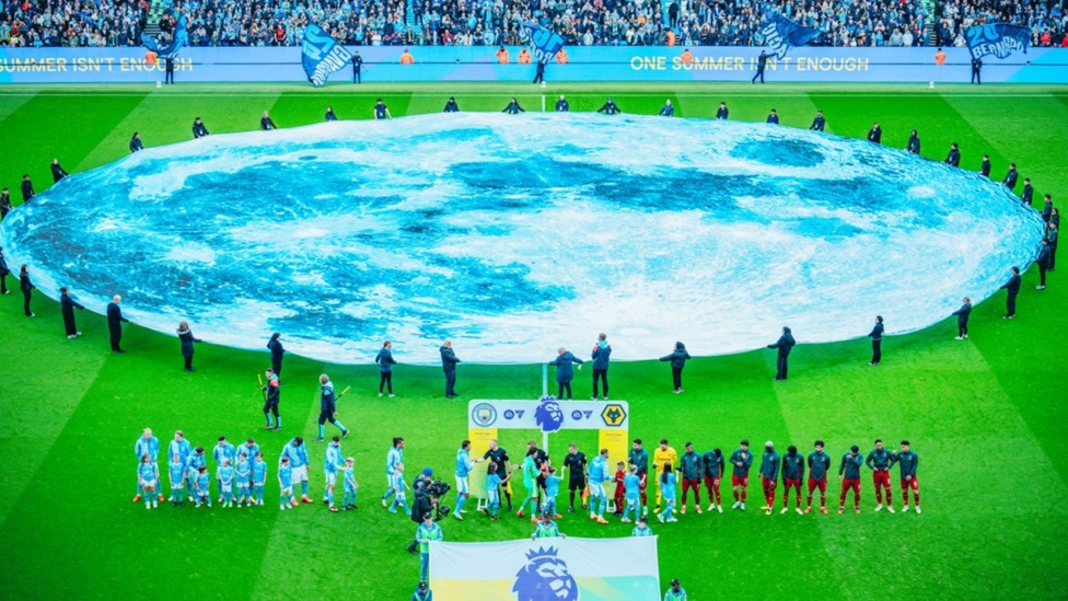 BLUE MOON: Players shake hands ahead of kick-off