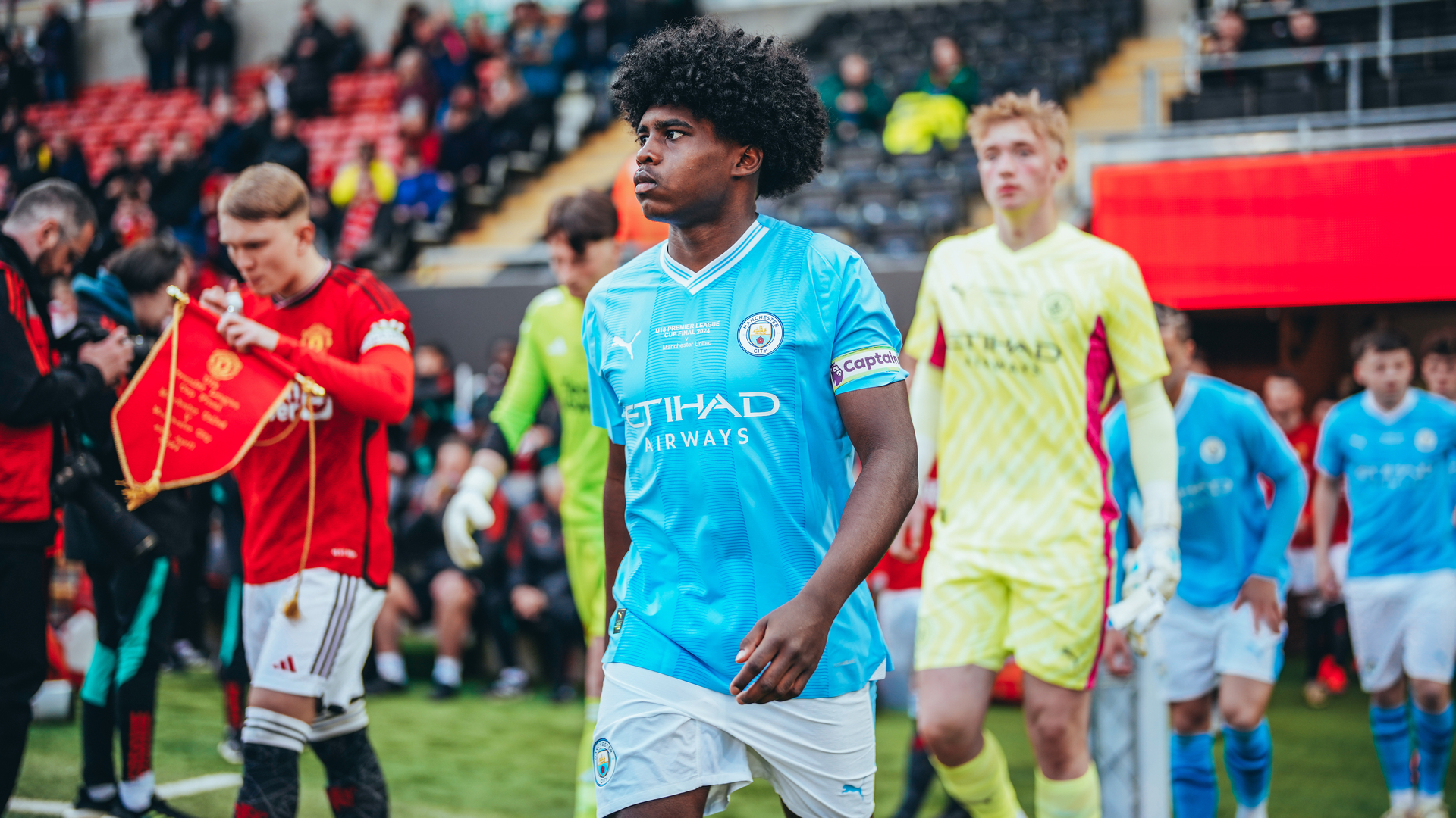 TIME FOR ACTION: Skipper Jaden Heskey leads the City team out at Leigh Sports Village.