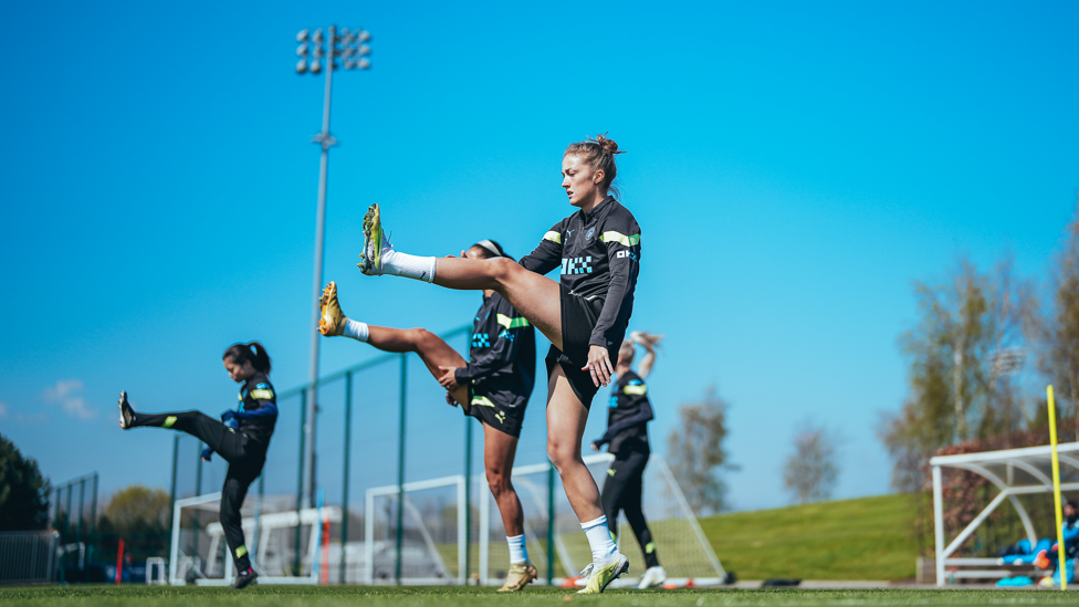 STRETCHING OUT : The players warm up for the session