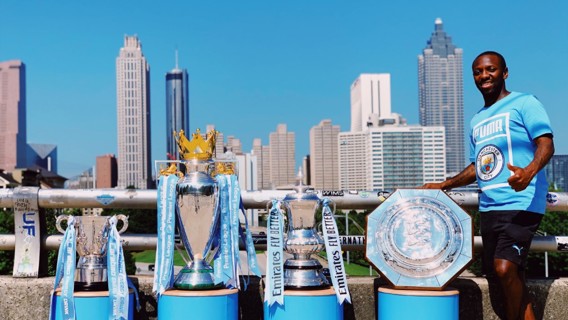 WORLDWIDE: Shaun Wright-Phillips poses with the four trophies won by our men's team in Atlanta.