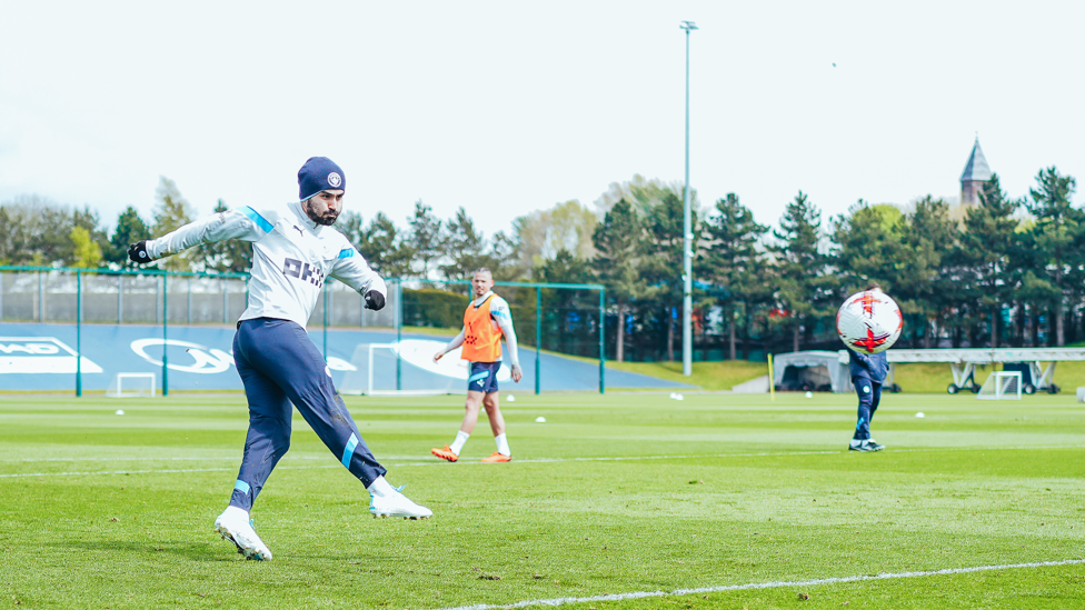 ICE COLD CAPTAIN : Ilkay Gundogan wraps up warm for some shooting drills.