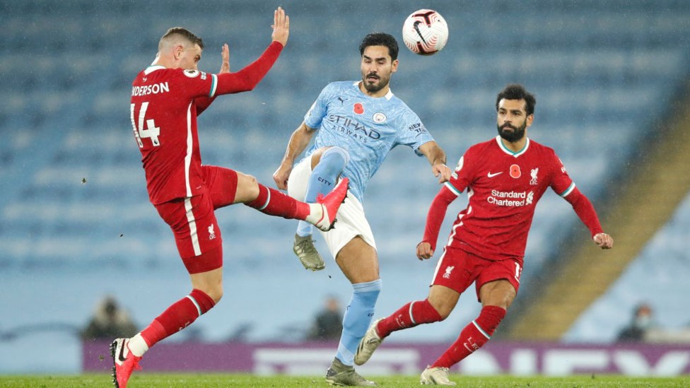 GUN-HO: Ilkay Gundogan battles for the ball with Jordan Henderson